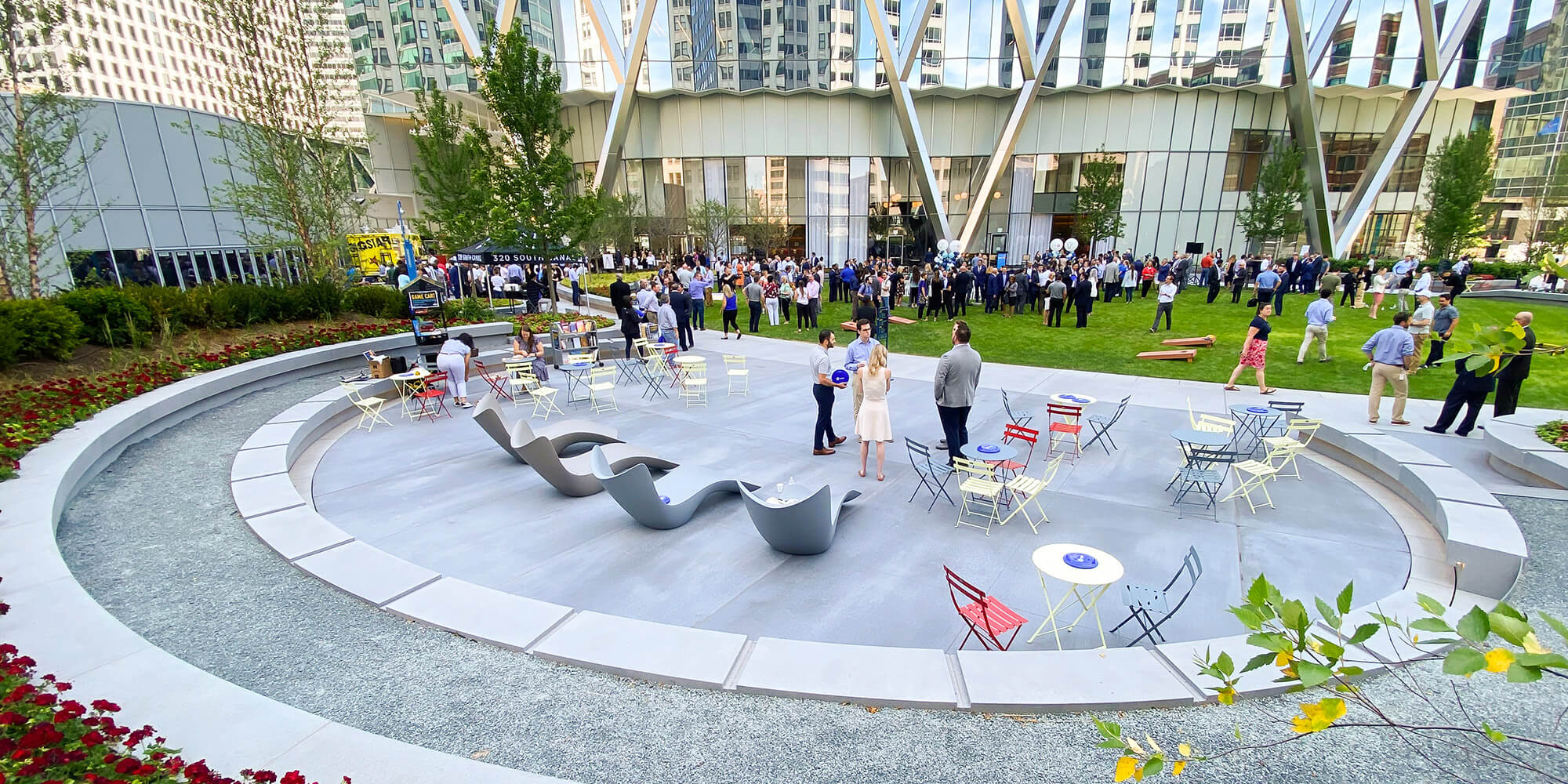 People enjoy a large outdoor event at The Green at 320